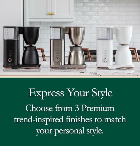 Three premium coffee makers in black, silver, and white finishes.